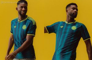 View of the Colombia 2026 Jersey away kit showing blue ocean-inspired patterns and green shoulder stripes.