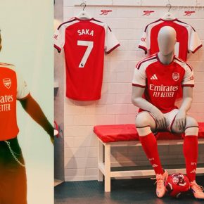 Front view of the 2026/27 Arsenal home jersey by adidas featuring a red body and white sleeves.