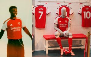 Front view of the 2026/27 Arsenal home jersey by adidas featuring a red body and white sleeves.