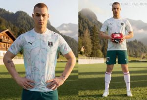 Close-up of the Austria World Cup 2026 Jersey showing marble patterns and gold Art Nouveau lines.