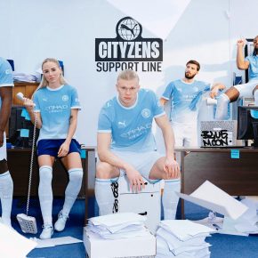 Manchester City 2026/27 jersey home kit featuring a sky blue gradient design and metallic monochrome crest.