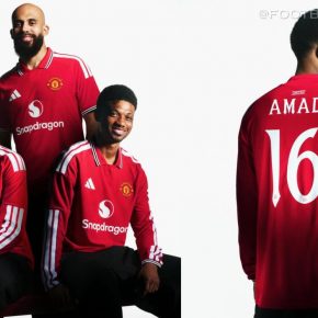 Manchester United 2026/27 jersey featuring a red base with a white polo collar and striped cuffs.