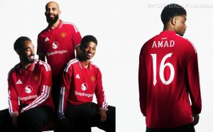 Manchester United 2026/27 jersey featuring a red base with a white polo collar and striped cuffs.