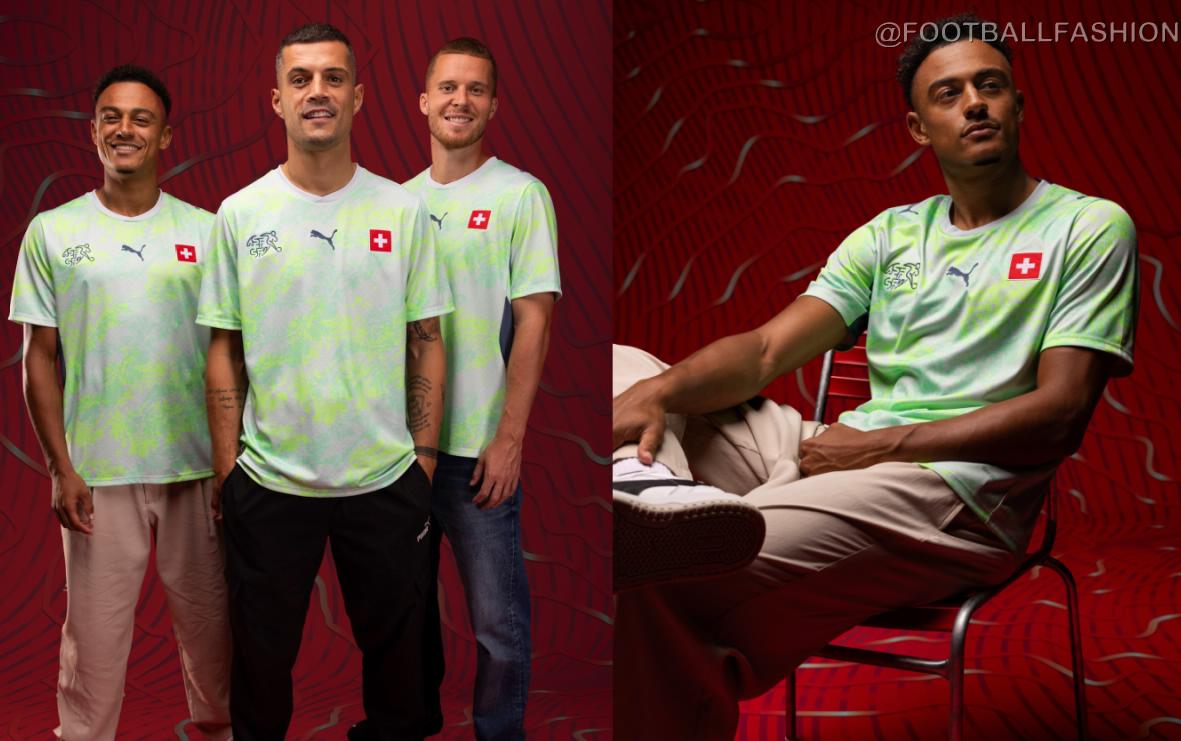 Switzerland 2026 Jersey away kit in Sea Glass and Dark Indigo with topographic pattern and white shorts.