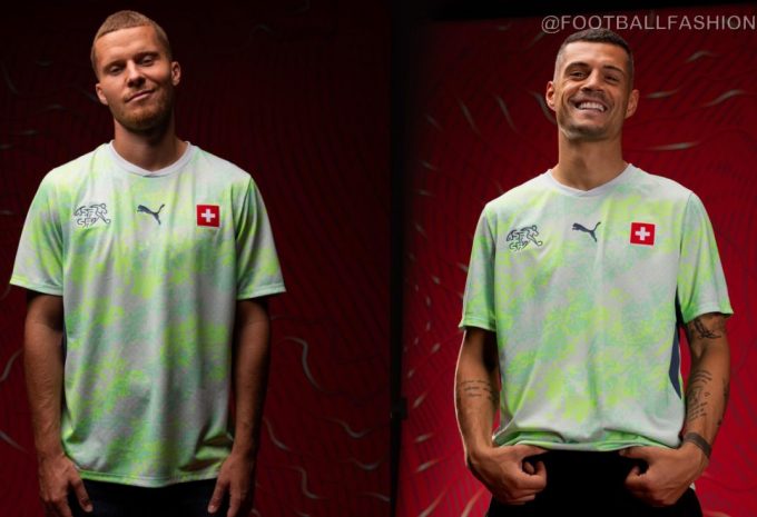 Switzerland 2026 Jersey away kit in Sea Glass and Dark Indigo with topographic pattern and white shorts.