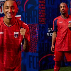 Player wearing the red Cabo Verde 2026 third jersey with a geometric pattern, dark blue sleeve panels, and federation crest.