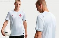 Canada 2026 third kit jersey by Nike in white with a tonal maple leaf graphic and black piping trim.