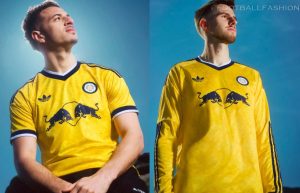 The yellow Leeds United 2026/27 jersey away kit featuring the night navy adidas Trefoil logo and the classic white rose crest.