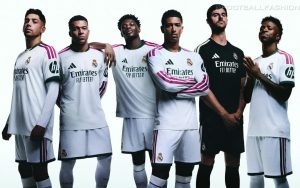 White Real Madrid 2026/27 Jersey featuring dark green collar details and pink adidas shoulder stripes