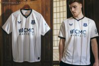 Everton Football Club 2026/27 Castore away jersey with vertical trinity amber and royal blue pinstripes, white sleeves, and royal blue shorts.