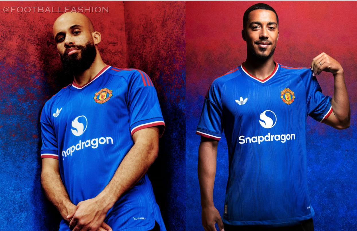 Manchester United 2026/27 royal blue away jersey by adidas with red shoulder stripes and Trefoil logo.