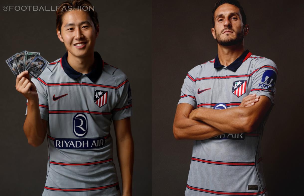 Nike Atlético Madrid 2026/27 third kit featuring a grey shirt with six thin red and blue hoops, blue collar, and grey shorts.