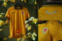 Wales 2026/27 Jersey by SUDU in day lily yellow with Welsh tapestry pattern and Scarab green details