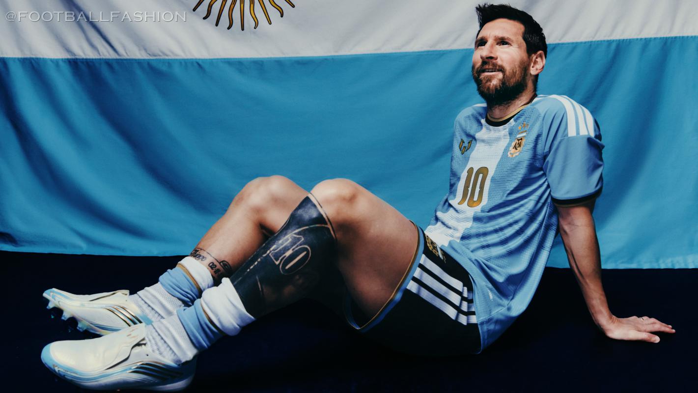 Front view of the sky-blue and white Argentina 2026 jersey featuring gold Messi logo and gold number 10.