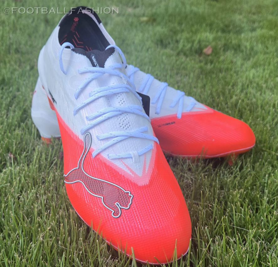 PUMA ULTRA NITRO 7 firm ground soccer boots resting on a natural grass pitch