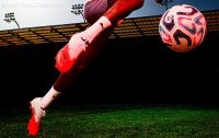 PUMA ULTRA NITRO 7 firm ground soccer boots resting on a natural grass pitch